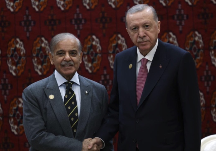 Turkish President Recep Tayyip Erdogan (R) receives Pakistani Prime Minister Shehbaz Sharif (L) as part of the International Peace and Security Forum in Ashgabat, Turkmenistan on Dec. 12, 2025.